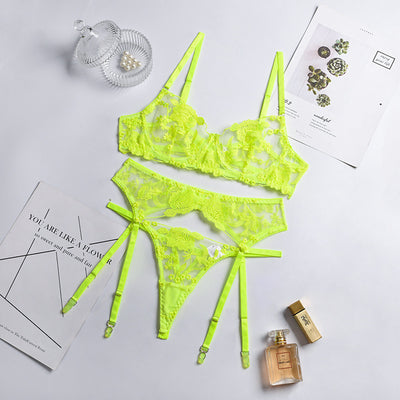 Purple embroidered lace three-piece lingerie set with underwire bra, thong, and garter belt on a white surface. - Image 2