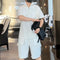 Conjunto Deportivo Holgado de Dos Piezas con Shorts