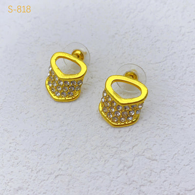 Gold-plated four-piece jewelry set with teardrop rhinestone necklace, bracelet, earrings, and ring on red velvet stands. - Image 7