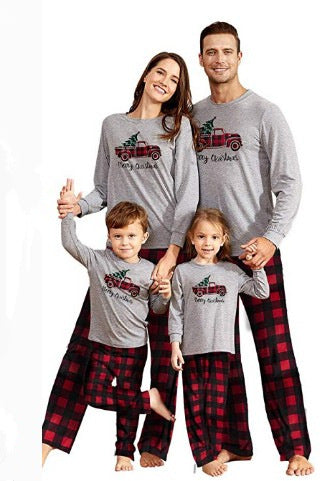 Family of four wearing matching gray long-sleeve pajamas with red truck and Christmas tree graphic, red and black plaid pants. - Image 10