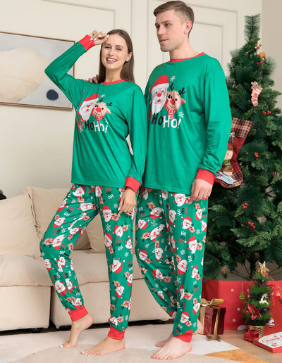 Family of four wearing matching green Christmas pajamas with Santa, reindeer, and "HoHo!" prints. - Image 7