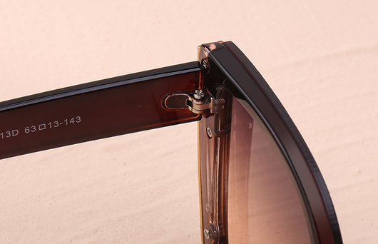 Women's black cat-eye sunglasses with large frames, gradient gray lenses, and gold-tone accents. - Image 19