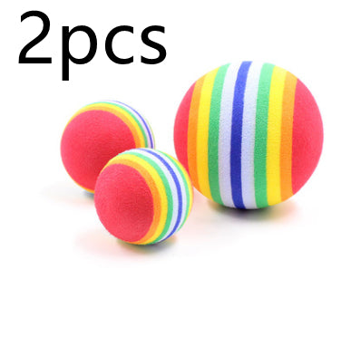 Rainbow striped foam pet toy ball, 6.3cm in diameter, with diagonal bands of red, orange, yellow, green, and blue. - Image 8