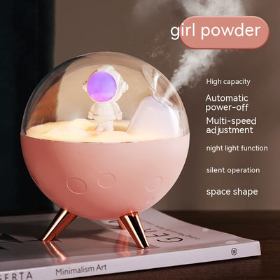 Space gray spaceman humidifier with a clear dome, glowing purple astronaut figurine, and warm yellow night light. - Image 4