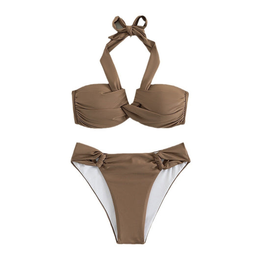 White solid color bikini swimwear with a halter top and knotted details on the top and bottom, modeled by a woman. - Image 9
