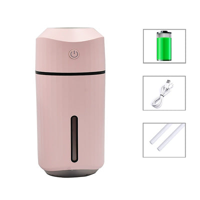 Pink portable humidifier with a power button, water level indicator, USB charging cable, and two cotton swabs. - Image 7