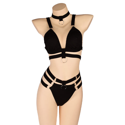 Woman wearing a royal blue strappy lingerie set with O-rings, including a bra, high-waisted bottoms, and a choker. - Image 8