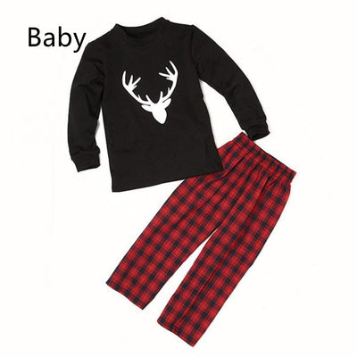 Mom's black long-sleeve pajama top with white deer head print and red and black plaid pajama pants. - Image 7