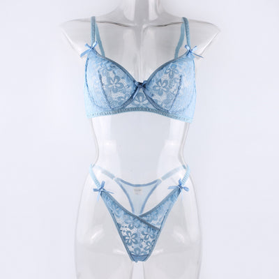 Light blue lace bralette and thong lingerie set with bow details and ruffle trim, displayed on a light surface. - Image 8