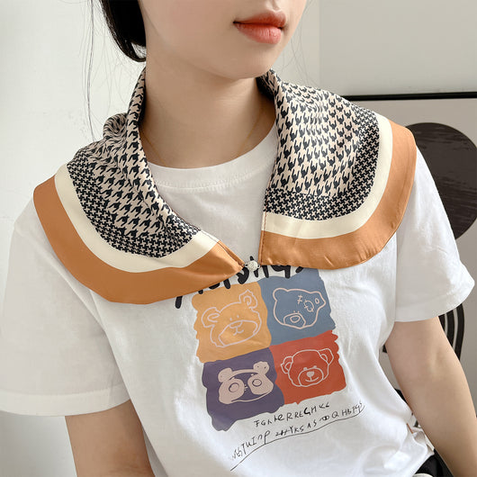 Female cream and black floral polka dot sun protection mask with ear loops, designed for eye corner protection. - Image 19