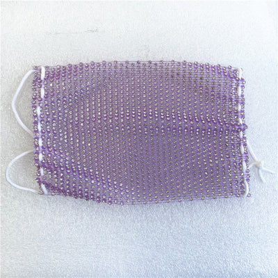 Close-up of a blue mesh fabric adorned with numerous small, clear rhinestones, creating a sparkling texture. - Image 68