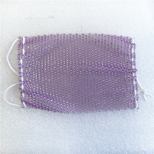 Close-up of a blue mesh fabric adorned with numerous small, clear rhinestones, creating a sparkling texture. - Image 68