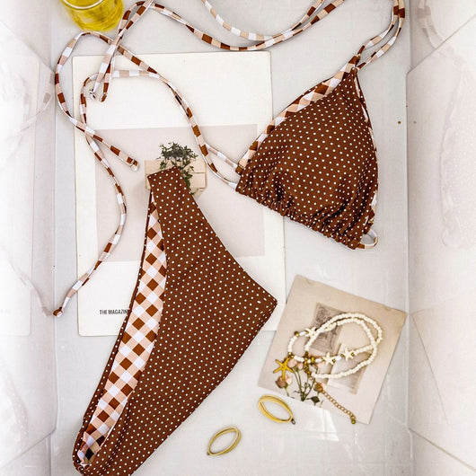 Retro brown and white plaid triangle bikini top with matching polka-dot bottoms, displayed flat with accessories. - Image 3
