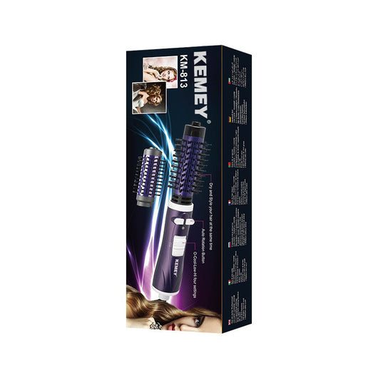 Purple and black hot air brush with a round barrel and bristles for curling or straightening hair. - Image 4