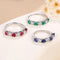 Anillo Apilable 7 Diamantes Rojo y Azul Esmeralda
