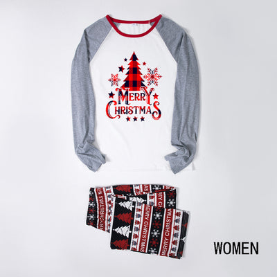 Family of four wearing matching Christmas pajamas with 'MERRY Christmas' text, leopard print, and plaid trees. - Image 22