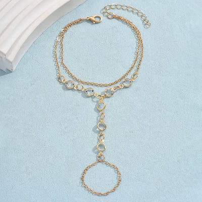 Gold-tone layered bracelet ring with clear crystal accents and a finger loop, featuring a lobster clasp closure. - Image 6