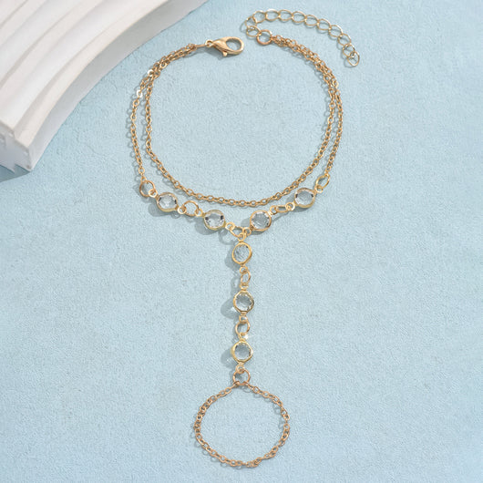 Gold-tone layered bracelet ring with clear crystal accents and a finger loop, featuring a lobster clasp closure. - Image 6