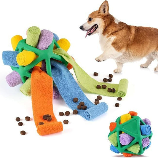 Colorful pet sniffing ball interactive toy with rolled fabric strips, shown with a corgi and scattered kibble.