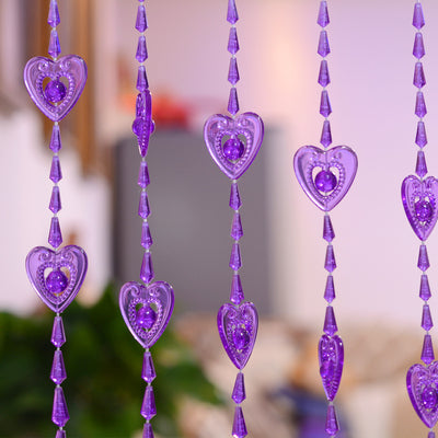 Close-up of a decorative door curtain with alternating red heart-shaped beads and clear faceted acrylic beads. - Image 7