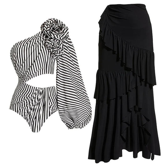 Black and white striped one-piece swimsuit with one-shoulder design, floral appliqué, balloon sleeve, and waist cut-outs. - Image 2
