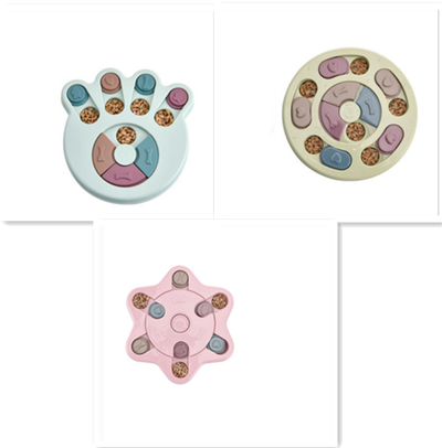 Paw-shaped dog puzzle feeder toy in light yellow with colorful sliding covers, filled with kibble. - Image 10