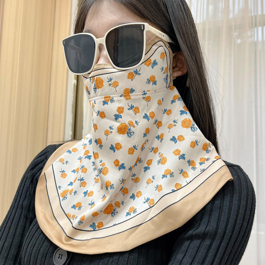 Female cream and black floral polka dot sun protection mask with ear loops, designed for eye corner protection. - Image 35