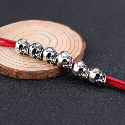 Red velvet rope with six silver-colored skull beads, ideal for DIY hair accessories or crafting projects. - Image 5