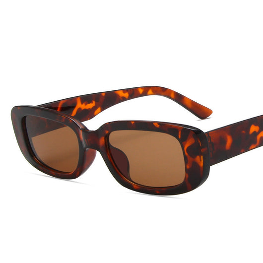 Black rectangular fashion sunglasses with dark lenses, featuring a thick frame and temples, angled on a white background. - Image 4