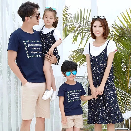 Navy blue short-sleeve t-shirt with a white floral-framed text print paired with light beige elastic-waist shorts. - Image 13