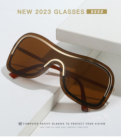 Women's fashionable shield sunglasses with a gold metal frame and dark gray lenses, featuring a unique wavy design. - Image 17
