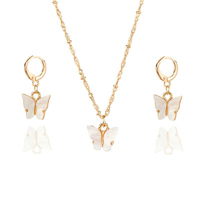 Pink acrylic butterfly necklace and earring set with gold-colored chain and hoop earrings. - Image 5