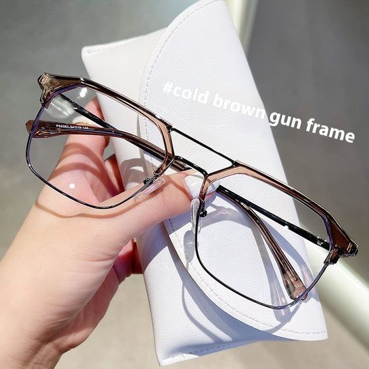 Anti-blue light glasses with a sand black and silver double beam frame, held against a white case. - Image 6