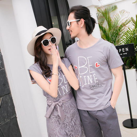 Family of four in matching grey "BE MINE" outfits. Mother and daughter wear lace skirts, father and son wear shorts. - Image 11