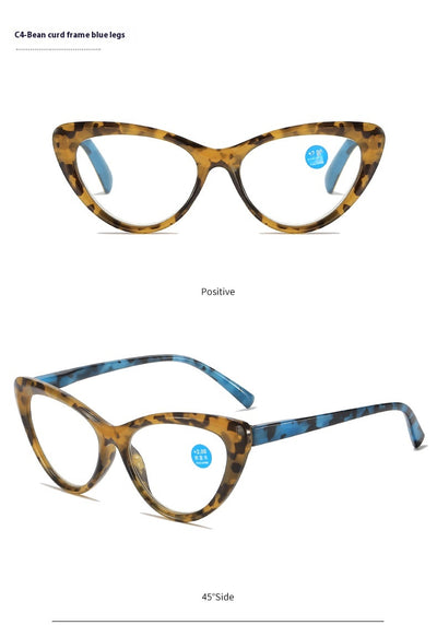 Black cat-eye anti-blue light reading glasses with green patterned temples on a white background. - Image 19