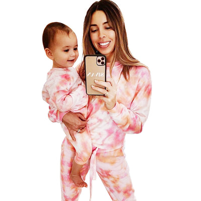 Woman wearing a pink and white tie-dye long-sleeve top and matching pants set, posing casually. - Image 5