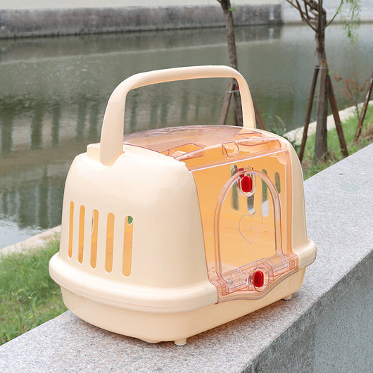 Brown pet carrier with a clear front door, top handle, ventilation slots, and a white urinating pad. - Image 3