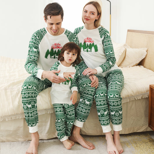 Family of three wearing matching white and green Christmas pajamas with reindeer and "Merry Christmas" text. - Image 11