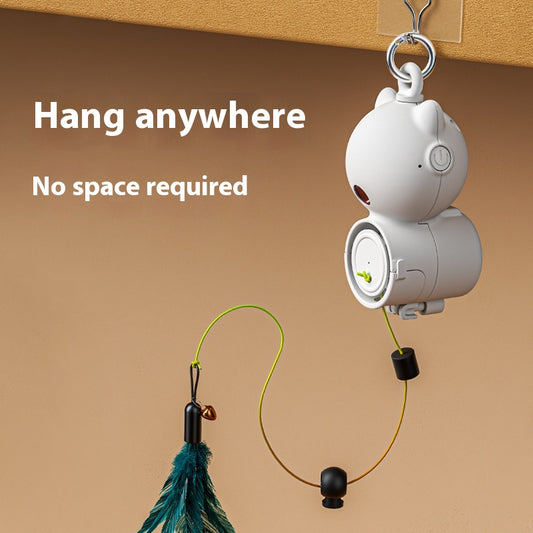 White retractable cat toy with a teal feather attachment hanging from a silver hook, designed for pet play.