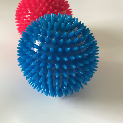 Red spiky TPR ball, a durable and bouncy toy for large dogs, designed for play and massage. - Image 9