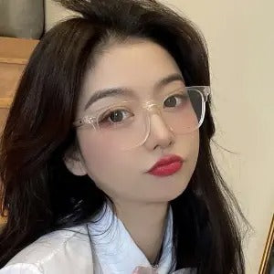 Retro square transparent full-frame glasses with blue light lenses, held by a person wearing grey sweatpants. - Image 18