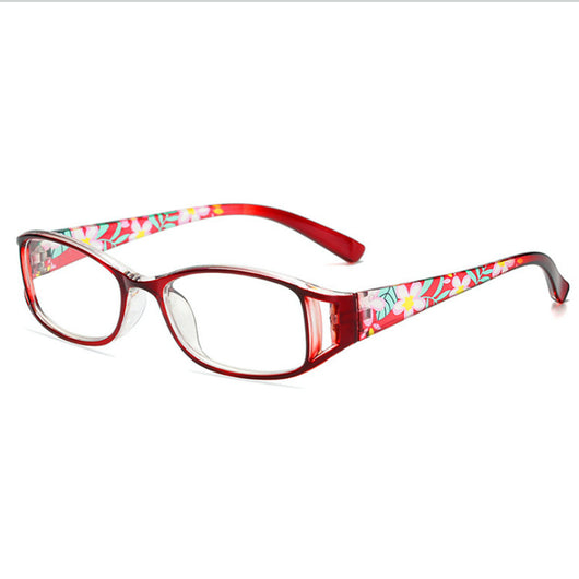Women's lightweight fashion reading glasses with a red frame and colorful floral print temples. - Image 4
