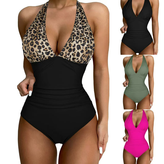 Black halter one-piece swimsuit with a deep V-neck and ruched detailing, designed for a slimming vacation look.