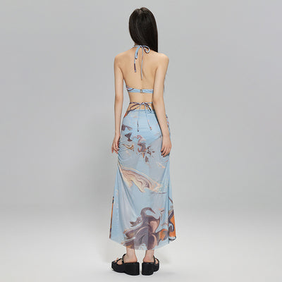 Light blue abstract print two-piece bikini set with a cropped halter top featuring chain straps and a ruched maxi skirt. - Image 4