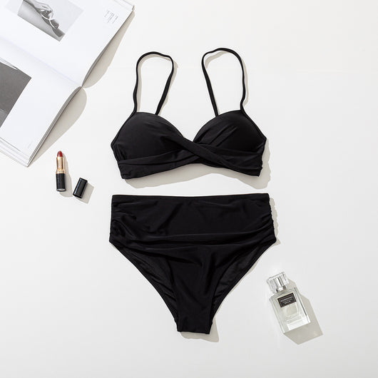 Women's black two-piece bikini with a twisted front bandeau top and high-waisted ruched bottoms. - Image 24