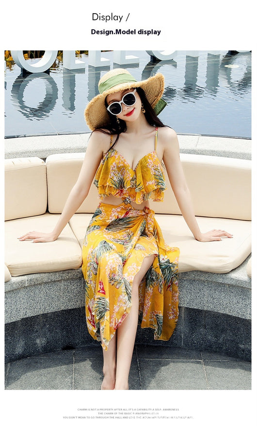 Pink tropical print three-piece women's swimwear set with ruffled bikini top, high-waisted bottoms, and matching sarong. - Image 14