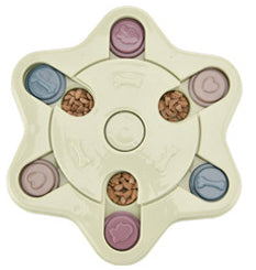 Paw-shaped dog puzzle feeder toy in light yellow with colorful sliding covers, filled with kibble. - Image 22