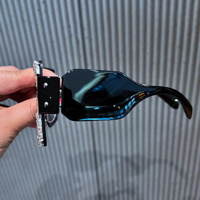 Oversized rectangular sunglasses with black lenses and frames heavily embellished with multiple rows of sparkling rhinestones. - Image 13