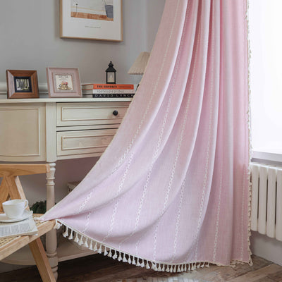 Black polyester curtain with white jacquard multi-line pattern and black tassels, draped over a white chair. - Image 9