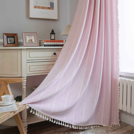 Black polyester curtain with white jacquard multi-line pattern and black tassels, draped over a white chair. - Image 9